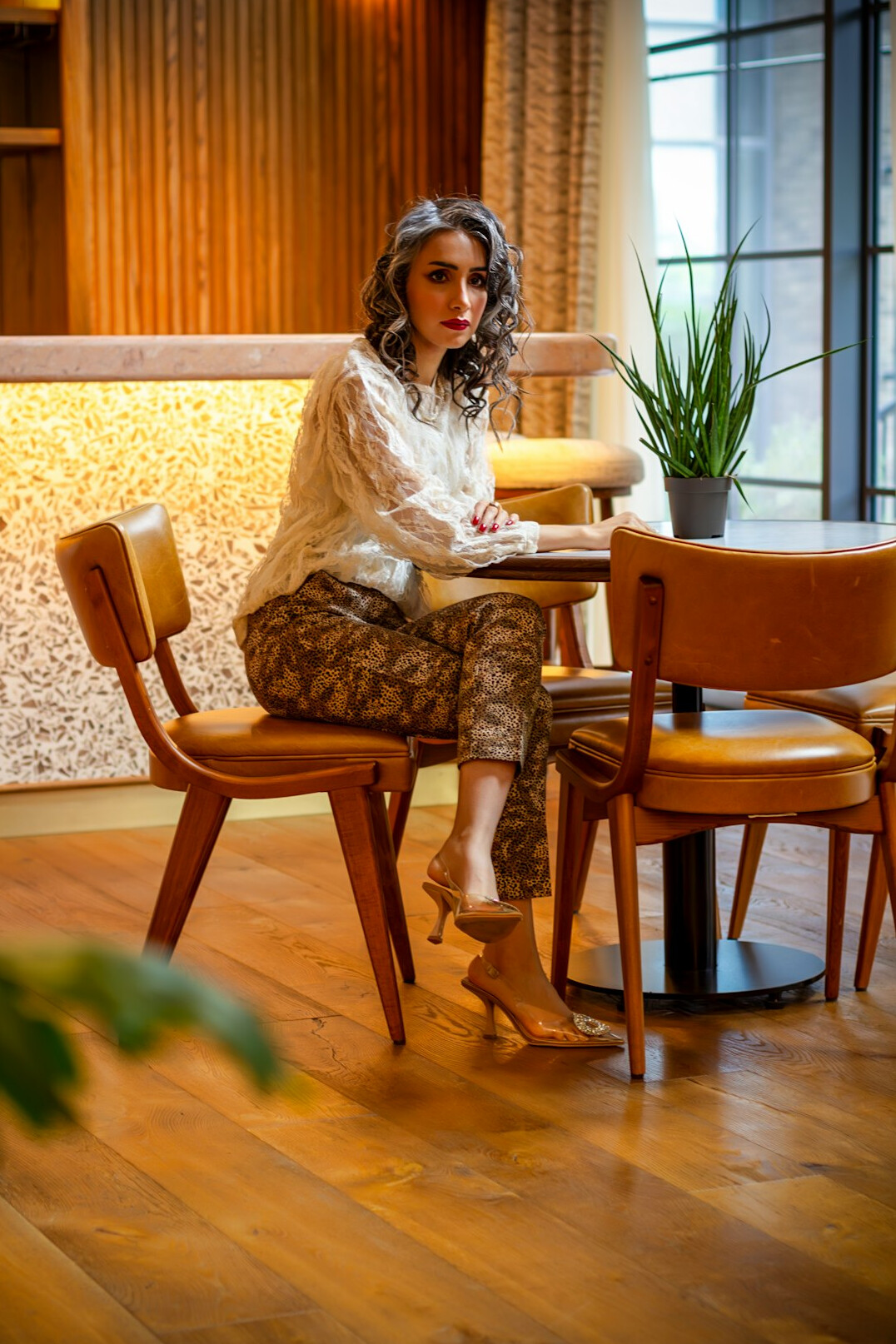Speaking coach mentoring a client in a stylish office